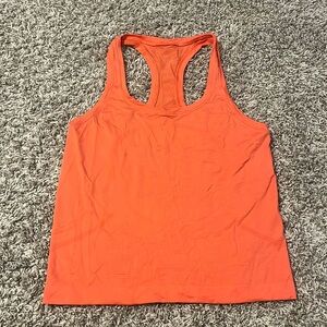 Lululemon women’s swiftly tech racerback waist length orange size 6. Worn twice